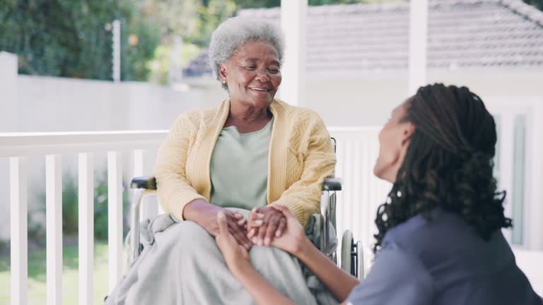 Caregiver and elderly person enjoying time together outdoors
