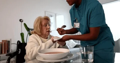Elderly woman smiling warmly with a family member